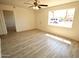 Spacious living area with laminate flooring and large windows at 5001 S 20Th Pl, Phoenix, AZ 85040