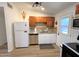 Well-equipped kitchen featuring granite counters and ample cabinet space at 2057 E Howe Ave, Tempe, AZ 85281