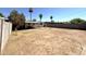 Large backyard with grassy area and a covered patio at 2057 E Howe Ave, Tempe, AZ 85281