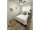 Bright bedroom with a queen-size bed and light flooring at 2057 E Howe Ave, Tempe, AZ 85281
