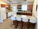 Updated kitchen with wood cabinets and granite countertops at 2057 E Howe Ave, Tempe, AZ 85281