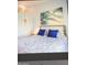 Relaxing bedroom with blue and white bedding and artwork at 7101 W Beardsley Rd # 452, Glendale, AZ 85308