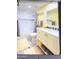 Bathroom with bathtub, double vanity, and yellow walls at 7101 W Beardsley Rd # 452, Glendale, AZ 85308