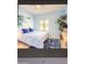Serene bedroom with blue and white bedding and artwork at 7101 W Beardsley Rd # 452, Glendale, AZ 85308