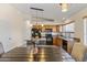 Kitchen with island, granite countertops, and wood cabinets at 15890 W Diamond St, Goodyear, AZ 85338