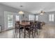 Casual dining area with wooden table and access to backyard at 24795 W Jones Ave, Buckeye, AZ 85326