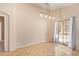 Dining area with tile floors and sliding glass door to backyard at 23780 W Tonto St, Buckeye, AZ 85326