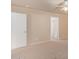 Carpeted bedroom with ceiling fan and access to bathroom at 23780 W Tonto St, Buckeye, AZ 85326