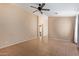 Spacious living room with tile flooring and a ceiling fan at 23780 W Tonto St, Buckeye, AZ 85326