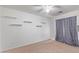 Bright bedroom with ceiling fan and neutral wall colors at 23780 W Tonto St, Buckeye, AZ 85326