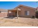 Home exterior and covered patio with gravel yard at 23780 W Tonto St, Buckeye, AZ 85326