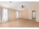 Living room with tile flooring, ceiling fan, and neutral-colored walls at 23780 W Tonto St, Buckeye, AZ 85326