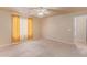 Bright bedroom featuring carpeted floors and ceiling fan at 23780 W Tonto St, Buckeye, AZ 85326