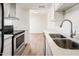 Modern kitchen with white cabinets and stainless steel appliances at 4015 S 45Th St, Phoenix, AZ 85040