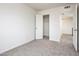 Bright bedroom with carpet flooring and a spacious closet at 4015 S 45Th St, Phoenix, AZ 85040