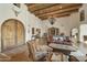 Living room features rustic wooden furniture and high ceilings at 4754 E Valley Vista Ln, Paradise Valley, AZ 85253