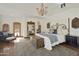 Spacious main bedroom with ornate headboard and a large window at 4754 E Valley Vista Ln, Paradise Valley, AZ 85253