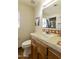 Simple bathroom with a wooden vanity and terracotta tile floor at 4754 E Valley Vista Ln, Paradise Valley, AZ 85253