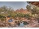 Expansive backyard with pool, mountain views, and relaxing lounge area at 4754 E Valley Vista Ln, Paradise Valley, AZ 85253