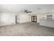 Open living room featuring gray floors and a modern kitchen island at 6131 E Monterey Way, Scottsdale, AZ 85251