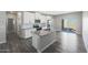 Modern kitchen featuring granite countertops, stainless steel appliances, and an island at 10347 N 115Th Ave, Youngtown, AZ 85363