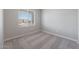 Simple bedroom with neutral walls and carpet flooring at 10347 N 115Th Ave, Youngtown, AZ 85363