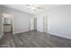 Primary bedroom with private bathroom and hardwood floors at 10347 N 115Th Ave, Youngtown, AZ 85363
