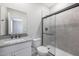 Bathroom with granite countertop, white vanity, and a glass shower at 10347 N 115Th Ave, Youngtown, AZ 85363