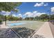 Outdoor basketball court with blue and green markings at 10347 N 115Th Ave, Youngtown, AZ 85363
