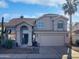 Two-story house with tile roof, arched entryway and two-car garage at 3815 E Wildwood Dr, Phoenix, AZ 85048