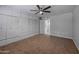 Spacious bedroom with ample closet space and ceiling fan at 9614 W Greenhurst Dr, Sun City, AZ 85351