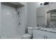 Updated bathroom with granite vanity and walk-in shower at 9614 W Greenhurst Dr, Sun City, AZ 85351