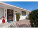 Front entrance with decorative iron door and welcoming entryway at 9614 W Greenhurst Dr, Sun City, AZ 85351