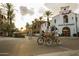 Couple biking through a vibrant town square at 20303 W Montecito Ave, Buckeye, AZ 85396