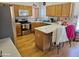 Kitchen with wood cabinets, island, and stainless steel appliances at 16549 N 91St Dr, Peoria, AZ 85382