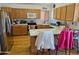 Kitchen with wood cabinets, island, and stainless steel appliances at 16549 N 91St Dr, Peoria, AZ 85382