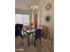 Dining room with glass table, chandelier, and wall decor at 16549 N 91St Dr, Peoria, AZ 85382