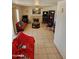 Living room with fireplace, couches, and tiled floor at 16549 N 91St Dr, Peoria, AZ 85382