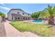 Spacious backyard with large pool and paved pathway at 654 S Sabrina --, Mesa, AZ 85208