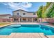 Inviting backyard oasis featuring a sparkling pool and spacious patio at 654 S Sabrina --, Mesa, AZ 85208