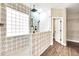 Updated bathroom with a walk-in shower and patterned tile at 654 S Sabrina --, Mesa, AZ 85208