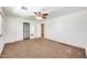 Bright bedroom with ceiling fan and mirrored closet doors at 654 S Sabrina --, Mesa, AZ 85208