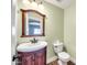 Clean bathroom with wood vanity and updated fixtures at 654 S Sabrina --, Mesa, AZ 85208