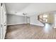 Spacious living room featuring hardwood floors and a view of the staircase at 654 S Sabrina --, Mesa, AZ 85208