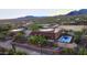 Aerial view of a charming home with a pool and expansive desert views at 37907 N 17Th Pl, Phoenix, AZ 85086