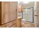 Bathroom with shower/tub combo and wood cabinets at 3330 E Main St # 440, Mesa, AZ 85213