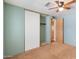 Bedroom with mirrored closet doors and ceiling fan at 3330 E Main St # 440, Mesa, AZ 85213