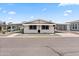 Front view of a manufactured home with a carport and walkway at 3330 E Main St # 440, Mesa, AZ 85213