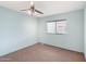 Bright bedroom with ceiling fan and carpeting at 3330 E Main St # 440, Mesa, AZ 85213