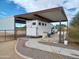 Covered RV parking area with a concrete pad and ample space at 26522 S Tangelo Ave, Queen Creek, AZ 85142